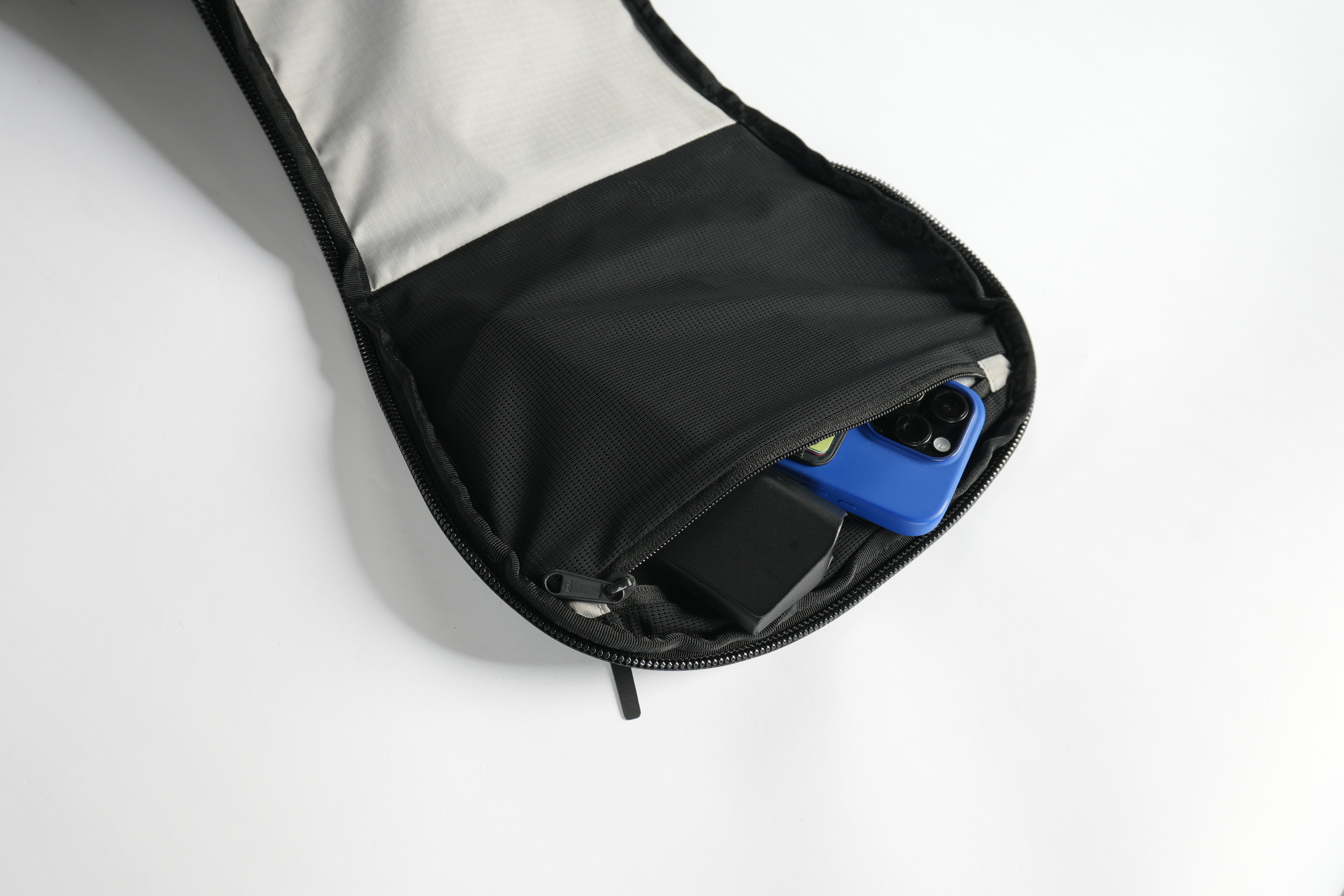 Inner mesh, zippered pocket with cellphone and other essentials inside DVRGE backpack