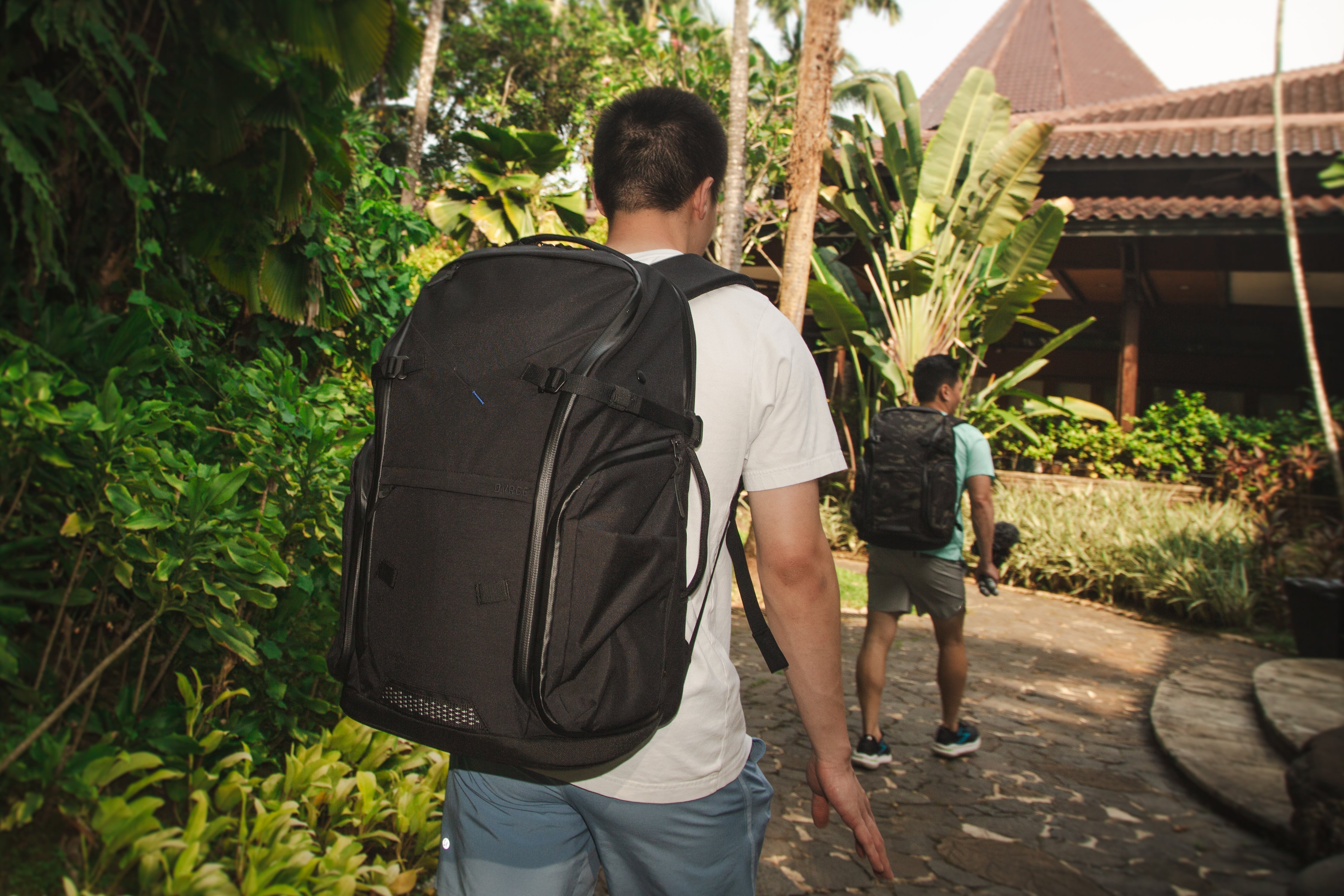 A man and his friend enjoying stress free travel to an international destination with DVRGE backpacks