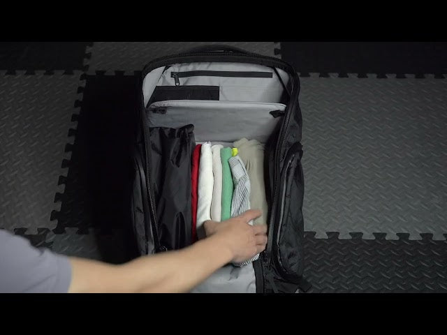Organized packing method demonstrated in DVRGE travel backpack for athletes