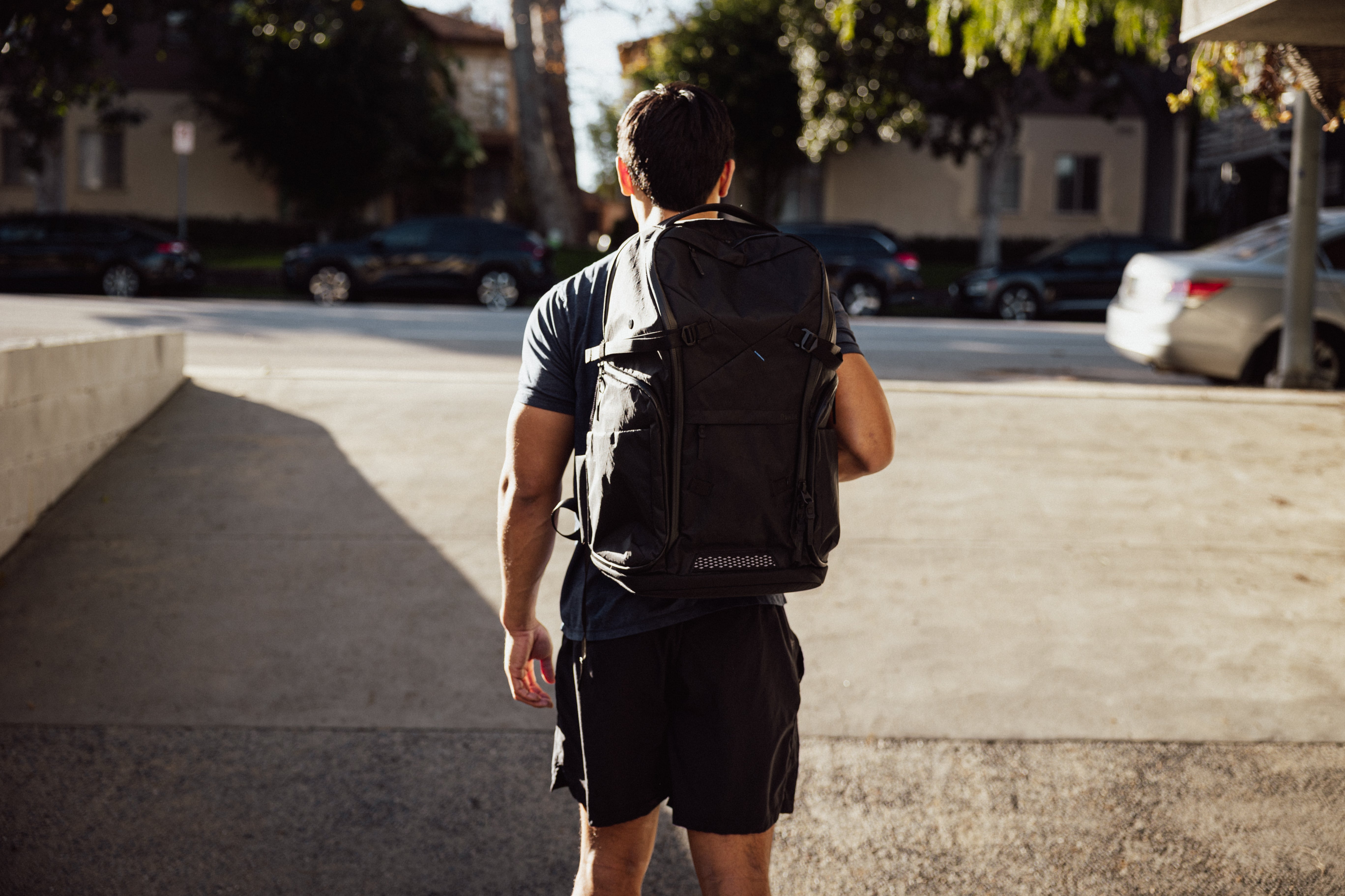 Man with backpack over right shoulder