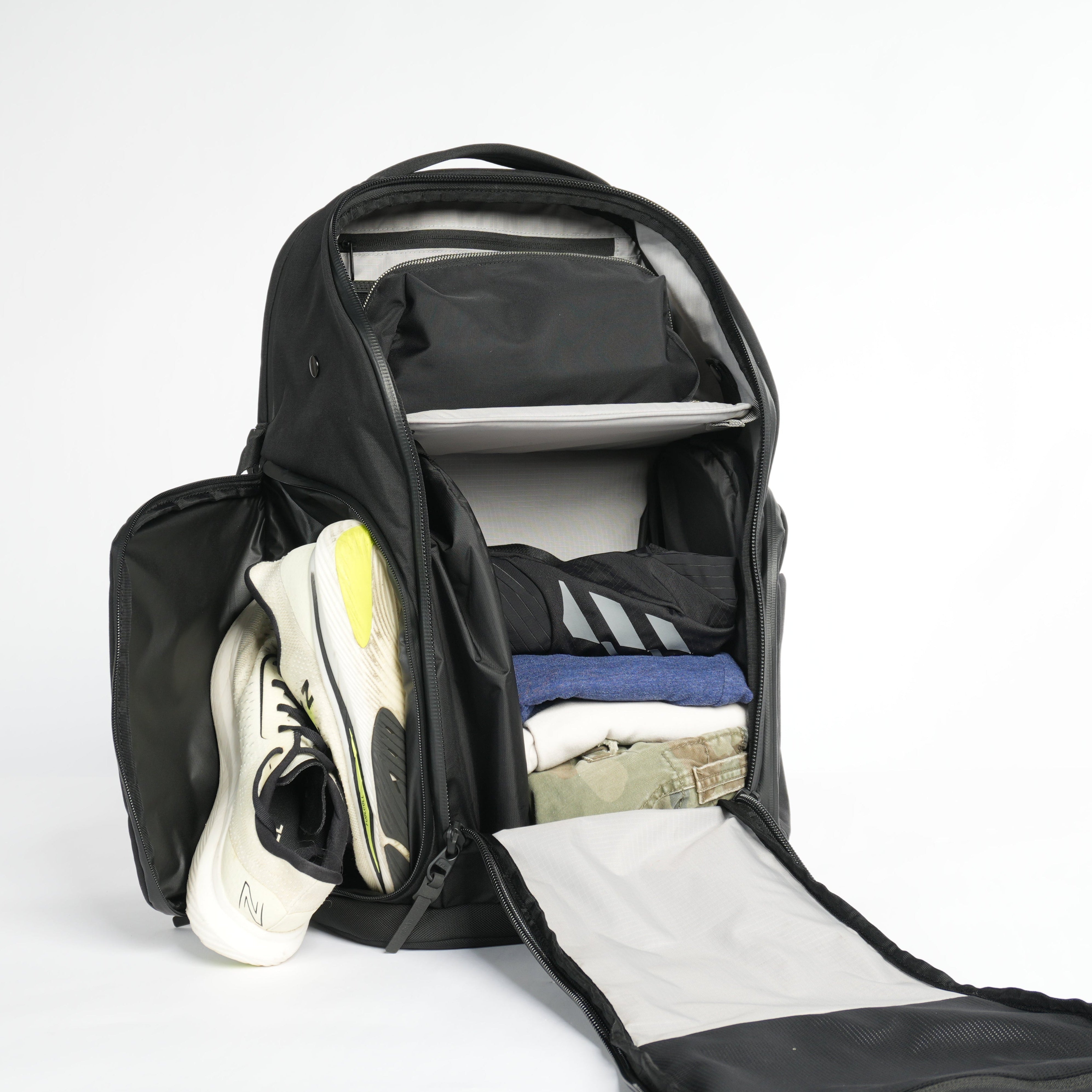 All compartments are opened on DVRGE backpack to display organizational features on white background