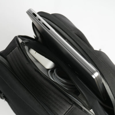 Laptop sitting in laptop pocket on DVRGE travel backpack 